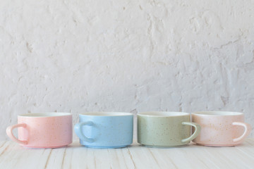modern ceramic cups on background white wall
