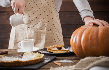 Obraz na płótnie Canvas woman with cup of coffee and pumpkin pie