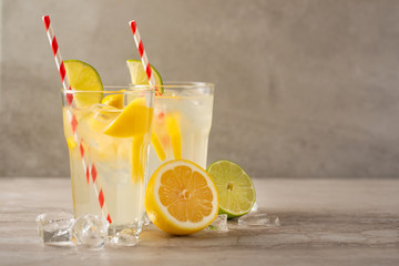 Lemonade. Drink with fresh lemons and limes. Summer mood, Lemon cocktail with juice and ice. Refreshing drink