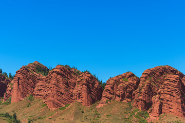 Mountain gorge Jety Oguz. Red rocks from Sandstone.  Rest in Kyrgyzstan. Nature in the area of lake...