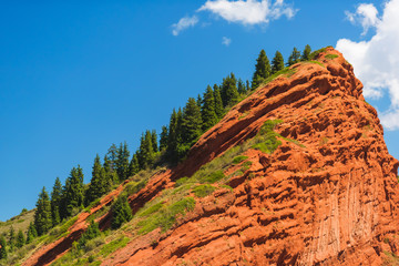 Mountain gorge Jety Oguz. Red rocks from Sandstone.  Rest in Kyrgyzstan. Nature in the area of lake...