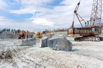 old marble quarry with heavy machinery