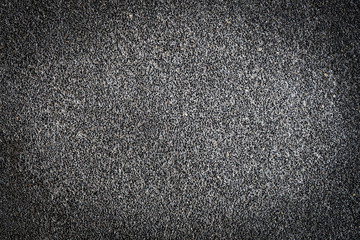 Dark grey porous texture of asphalt