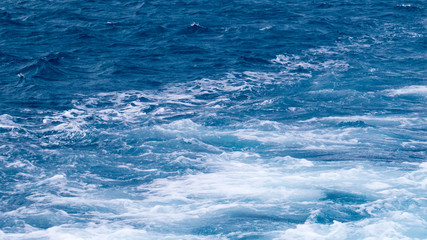 Windy/Cloudy day over the surface of the Atlantic Ocean viewed from a beach in Nassau, The Bahamas.