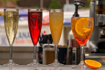 line of champagne cocktails at bar
