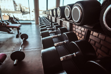 Photo of sport equipment in trendy sunny gym.