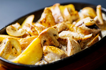 pan with potatoes, meat and mushrooms, baked in the oven