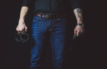 Strict man with black collar and black cuffs. BDSM concept.