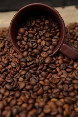 Coffee cup and coffee beans. Can be used as a background.