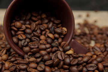 Coffee cup and coffee beans. Can be used as a background.