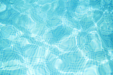 Fototapeta na wymiar Abstract blue water in swimming pool