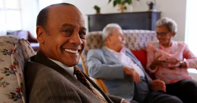 Group of Mixed race senior friends interacting with each other at nursing home