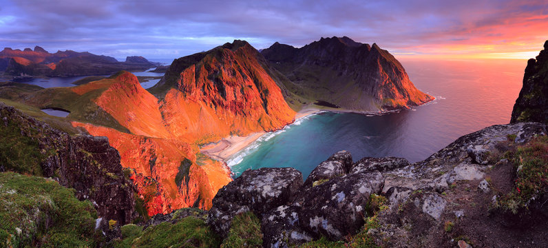 Stunning dramatic view of Kvalvika Beach at sunset in Norway, Lofoten islands.