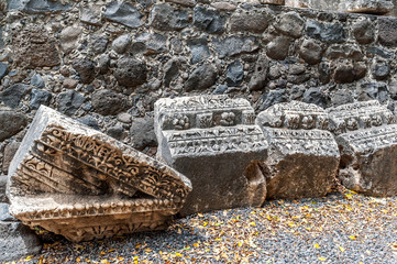 details of the decor of the ancient synagogue ruins in the city of Capernaum, the birthplace of St....