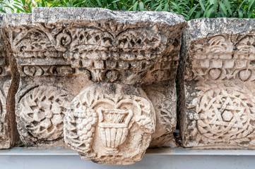 details of the decor of the ancient synagogue ruins in the city of Capernaum, the birthplace of St....