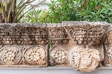 details of the decor of the ancient synagogue ruins in the city of Capernaum, the birthplace of St....