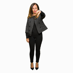 Fototapeta premium Beautiful middle age woman wearing fashion jacket looking unhappy and angry showing rejection and negative with thumbs down gesture. Bad expression.