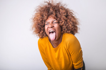 Fototapeta na wymiar pretty Afro woman showing her tongue