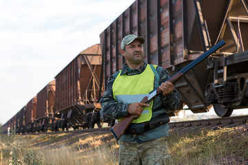 Hunters with a german drathaar and spaniel, pigeon hunting with dogs in reflective vests	