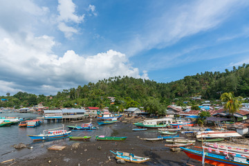 colorful ships in indonesia street of lembeh