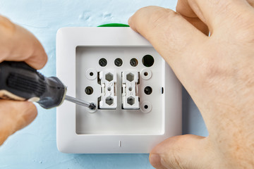 Tightening screw in light switch.