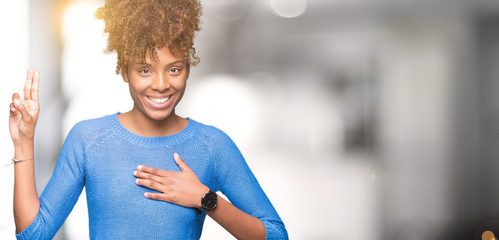Beautiful young african american woman over isolated background Swearing with hand on chest and fingers, making a loyalty promise oath - obrazy, fototapety, plakaty