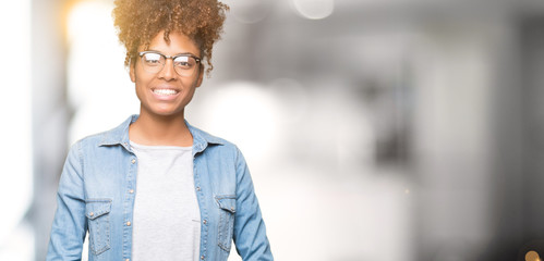 Beautiful young african american woman wearing glasses over isolated background Hands together and fingers crossed smiling relaxed and cheerful. Success and optimistic