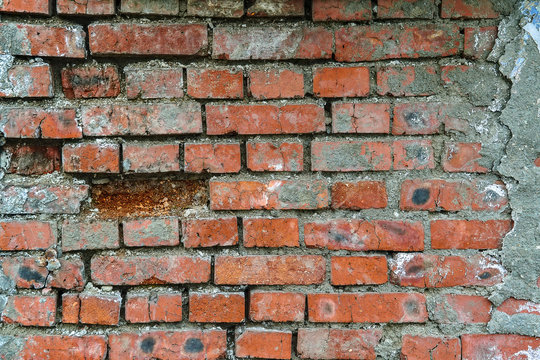 The texture of the brickwork Fragment of the wall of red brick