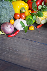 Organic vegetables on white wooden background, Top view.