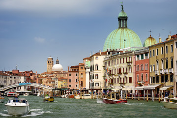 VENICE, ITALY - APRIL 24, 2019: View of Grand Canal, Scalzi bridge, San Simeon Piccolo's Church of Venice