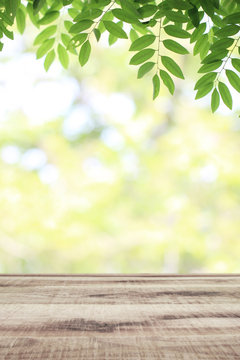 Wooden Table And Blurred Green Nature Garden Background.