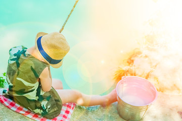 happy child fishes off the coast in nature © Kostia