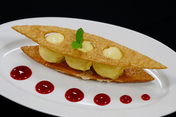 vanilla ice creams with raspberry coulis and crispy puff pastry