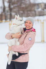 woman with puppy siberian husky