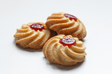 Close-up of tree shortbread cookies isolated on white background.