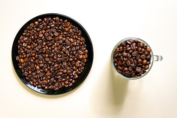 Coffee cup with roasted beans. Top view with copy space for your text