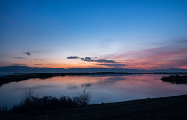 Beautiful sunrise on the lake. Colorful sky.