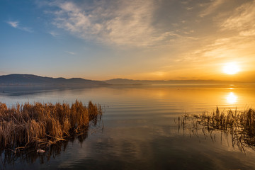 Beautiful sunrise on the lake. Colorful sky.