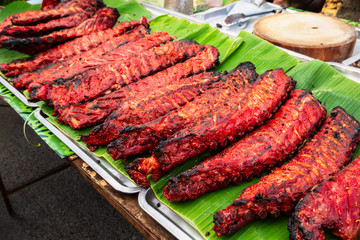 Thai street food red pork ribs on the market