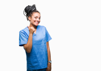Young braided hair african american girl professional nurse over isolated background doing happy thumbs up gesture with hand. Approving expression looking at the camera with showing success. - obrazy, fototapety, plakaty