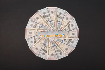 Pill box on mandala kaleidoscope from money.