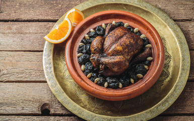 Whole chicken tajine, moroccan food, copy space.