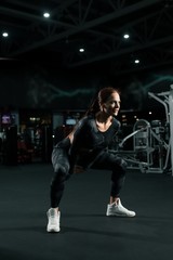 Fototapeta na wymiar Slim fitness trainer in sportswear view