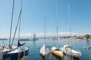 Fototapeta na wymiar Private yachts docked in Lausanne Ouchy port, Switzerland on Lake Leman (Geneva Lake)