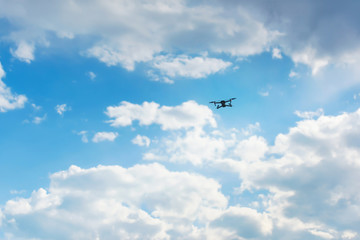Copter for video flying against a cloudy sky. Rest in Kyrgyzstan. Shooting nature Issyk Kul from a...
