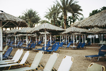 white loungers sunbeds on beach