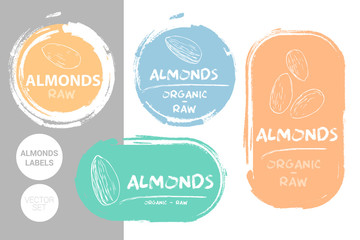 Almonds colorful label set. Raw organic almond nuts Badge shapes. Creative Nut tags. Raw food stickers ready for web and print. Painting brush style labels. Brush stroke badges in pastel colors.