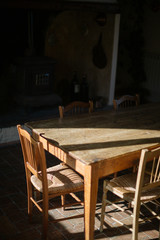 old wooden table with harsh shadows