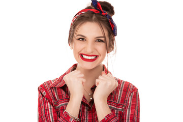 woman amazed or shocked by unexpected news holding fists up