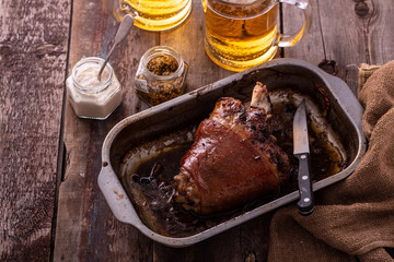 Honey glazed pork knuckle with beer. copy space